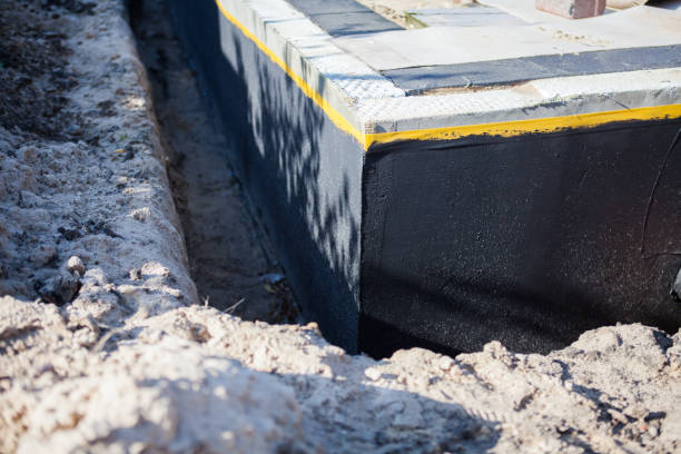Professional Waterproofing technician working in Lexington, IN
